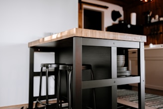 a kitchen island with a wooden counter top