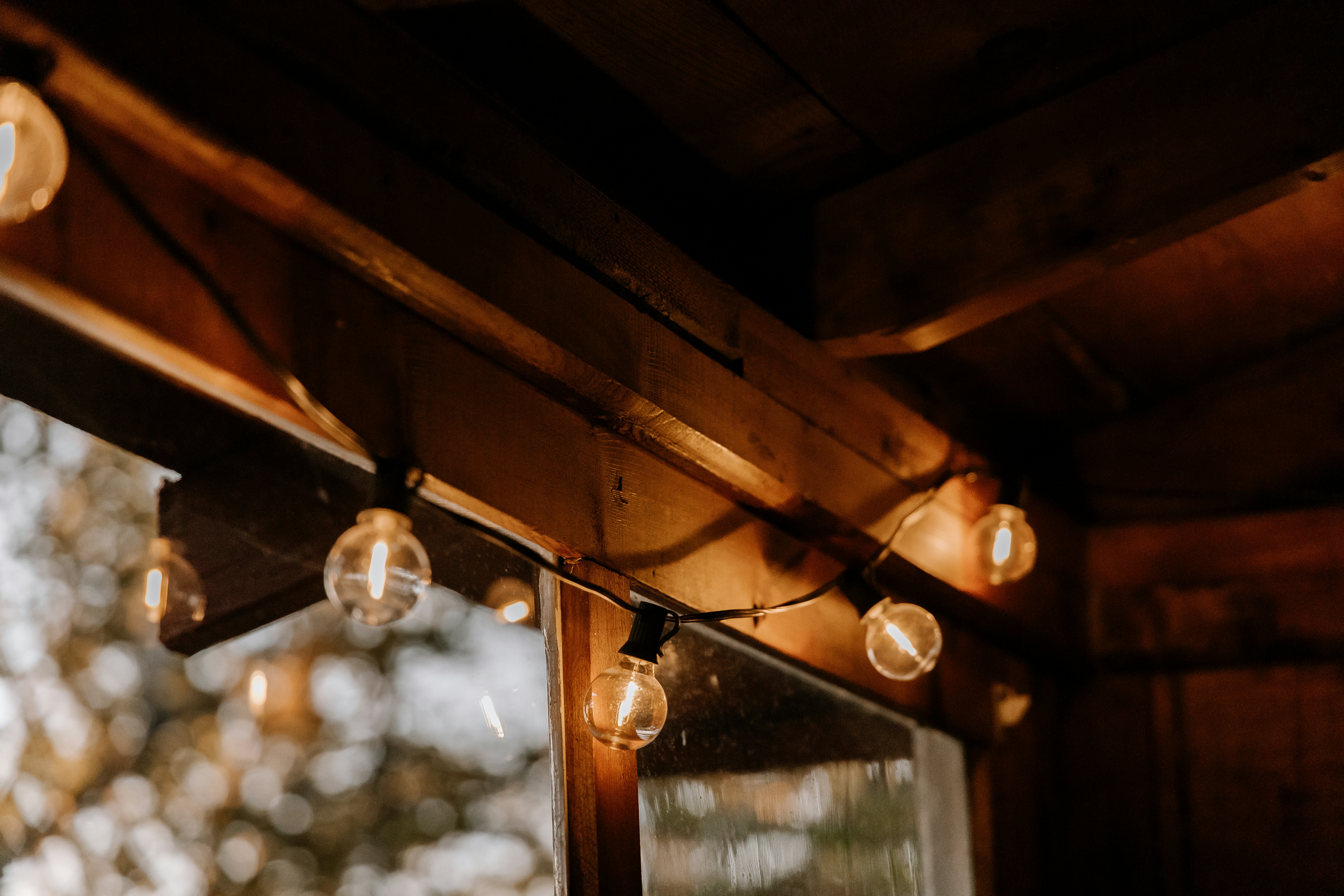 a group of lights hanging from a wooden ceiling
