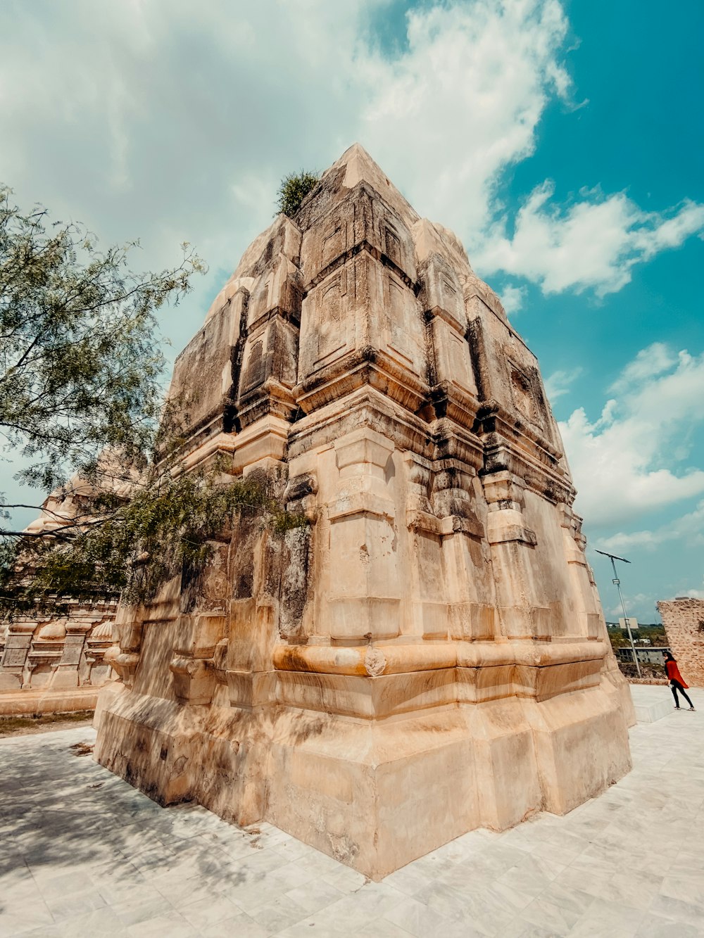 a large stone structure sitting on top of a sandy beach