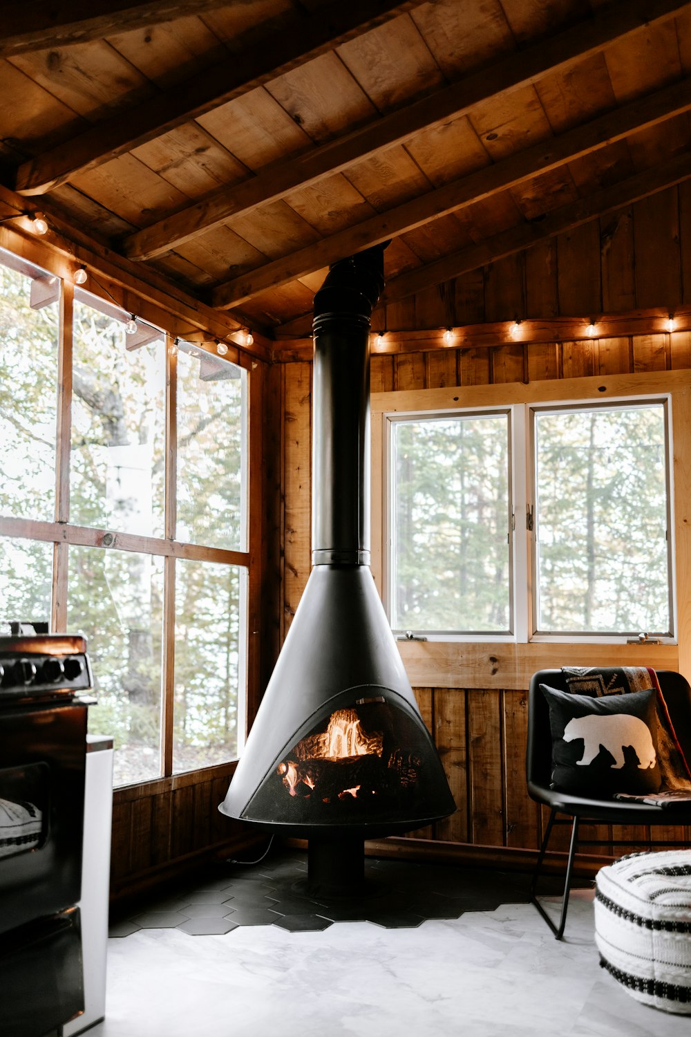 a living room with a wood burning stove