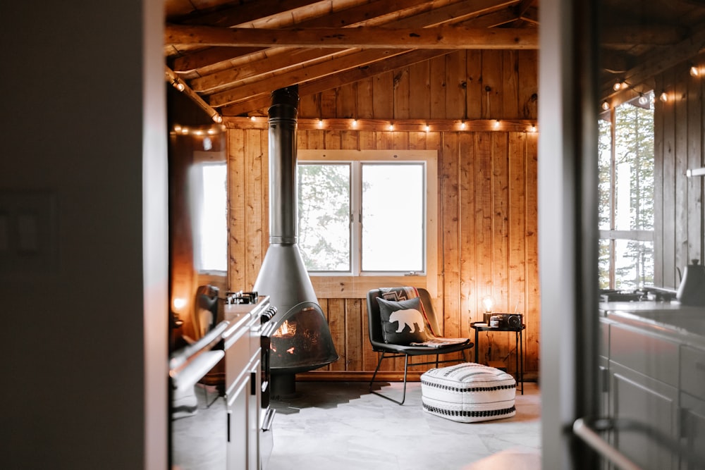 a living room with a fire place and a chair