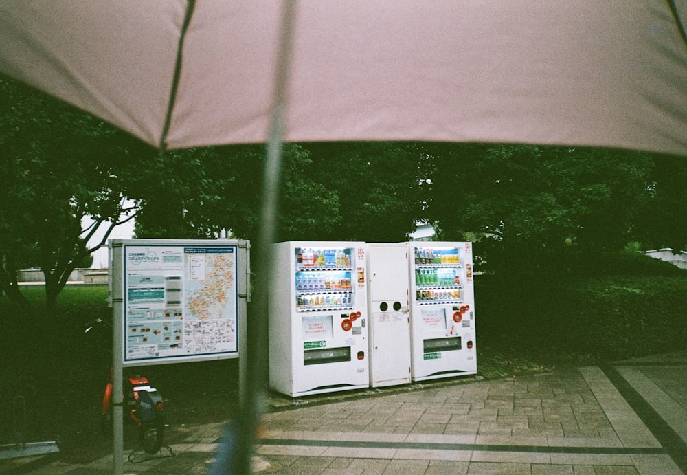 a couple of vending machines sitting next to each other