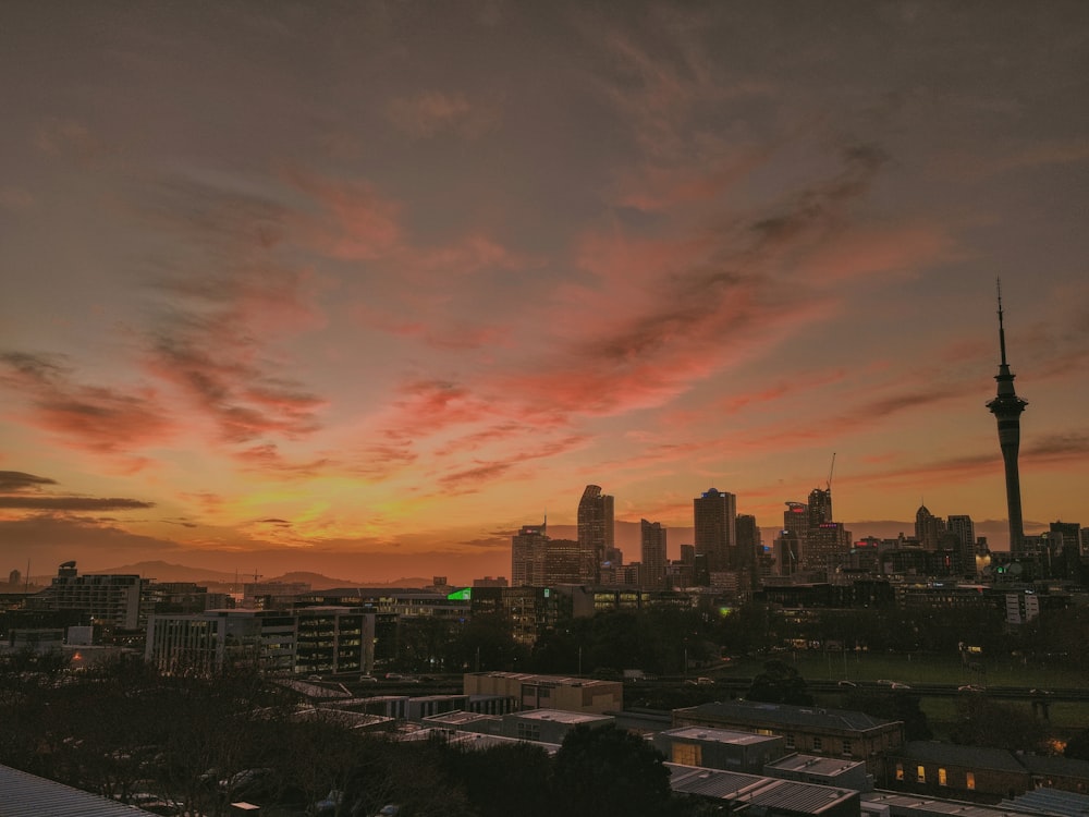 a view of a city skyline at sunset