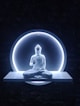 a buddha statue sitting in front of a blue light