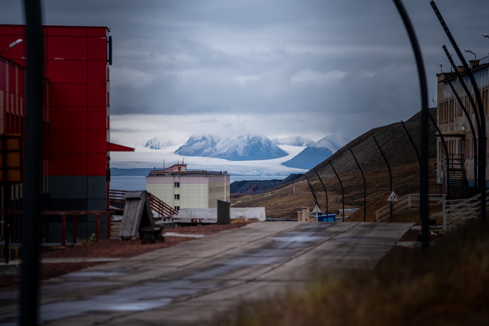 a red building sitting on the side of a road