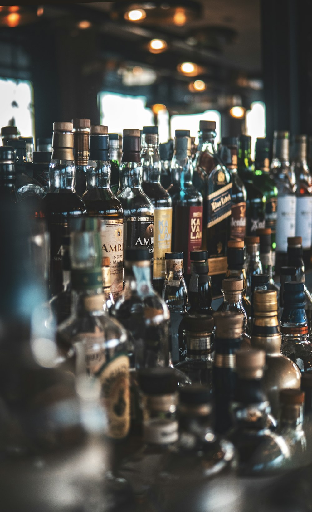 a bunch of bottles of liquor sitting on a table