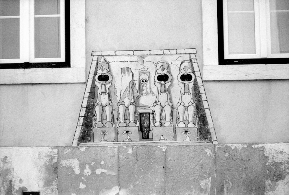 a black and white photo of a building with a window