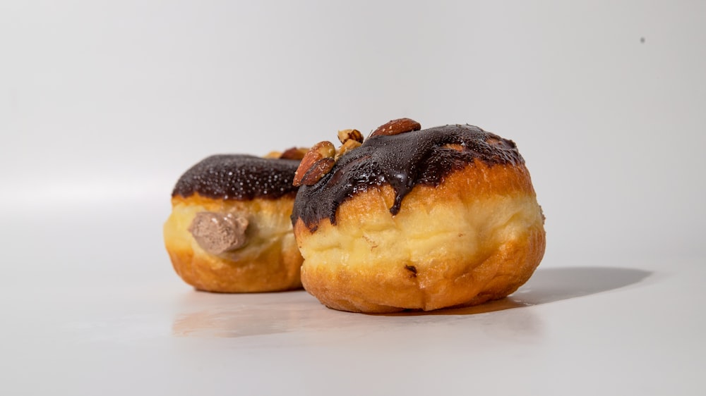 a couple of doughnuts sitting on top of a table