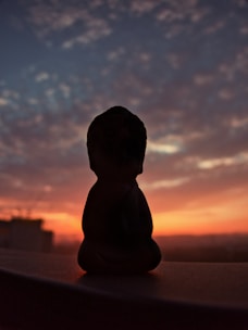 a small figurine sitting on top of a table