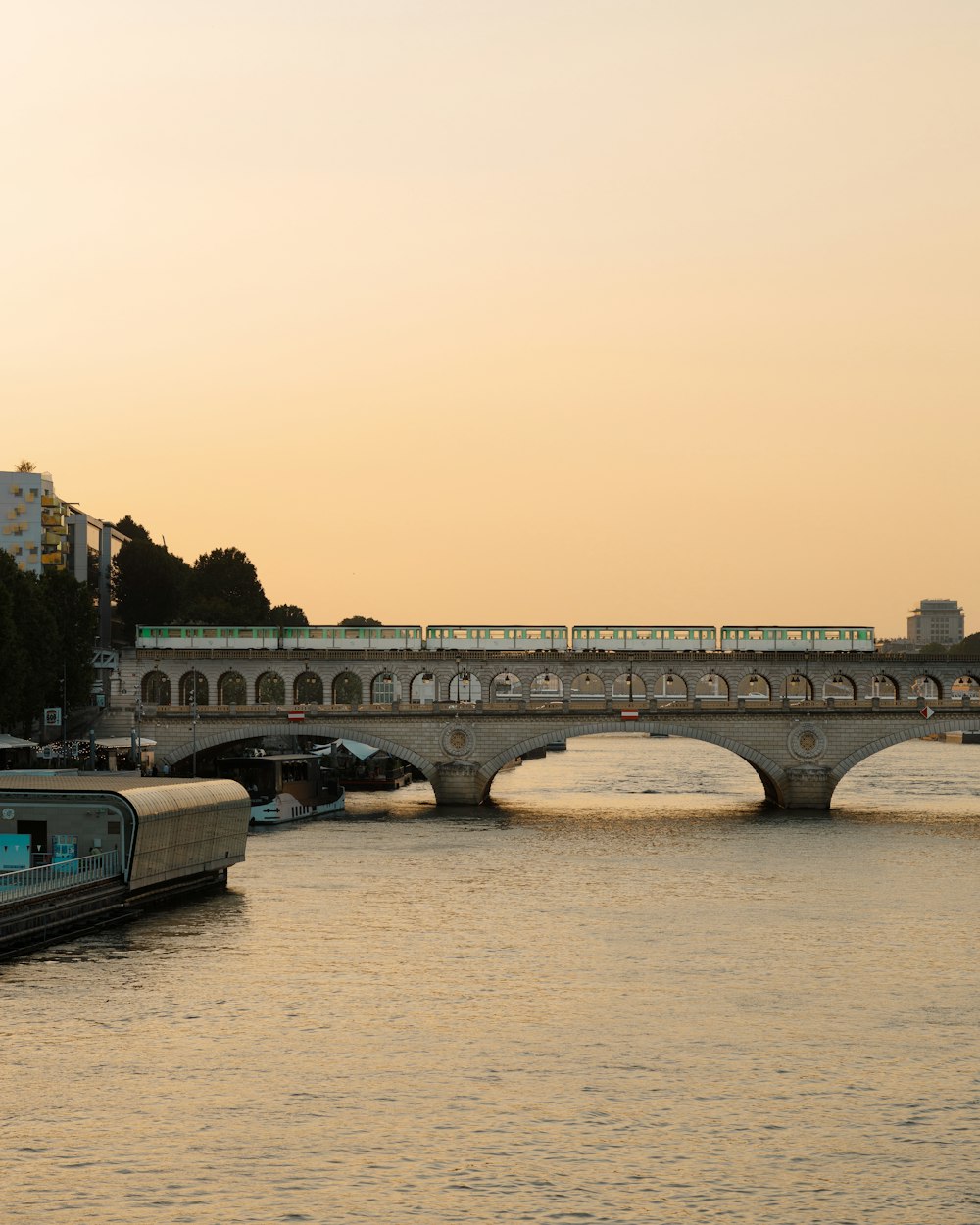 a train crossing a bridge over a body of water