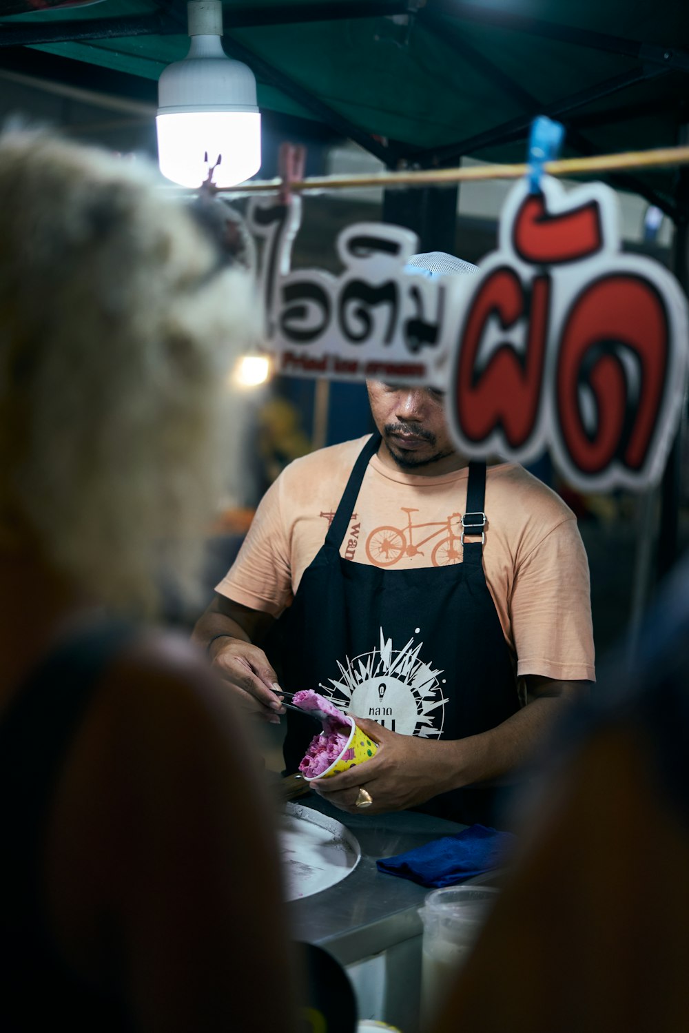 a man standing in front of a table with a plate of food