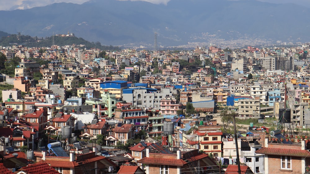 a view of a city with mountains in the background