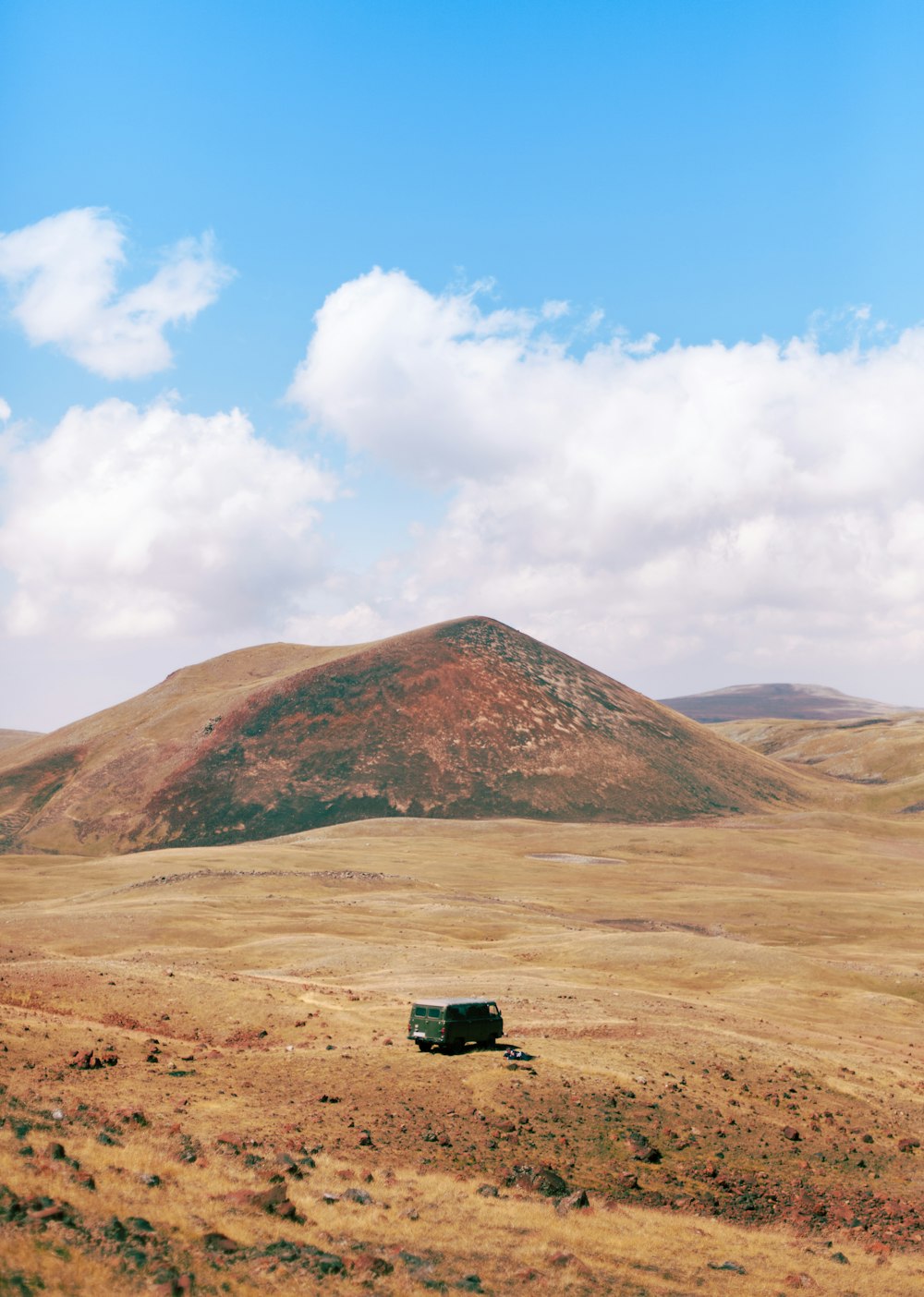 a truck is parked in the middle of a field