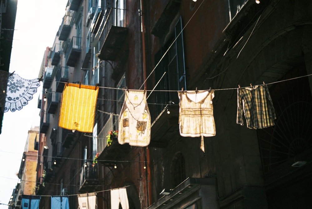 clothes hanging on a clothes line on a city street