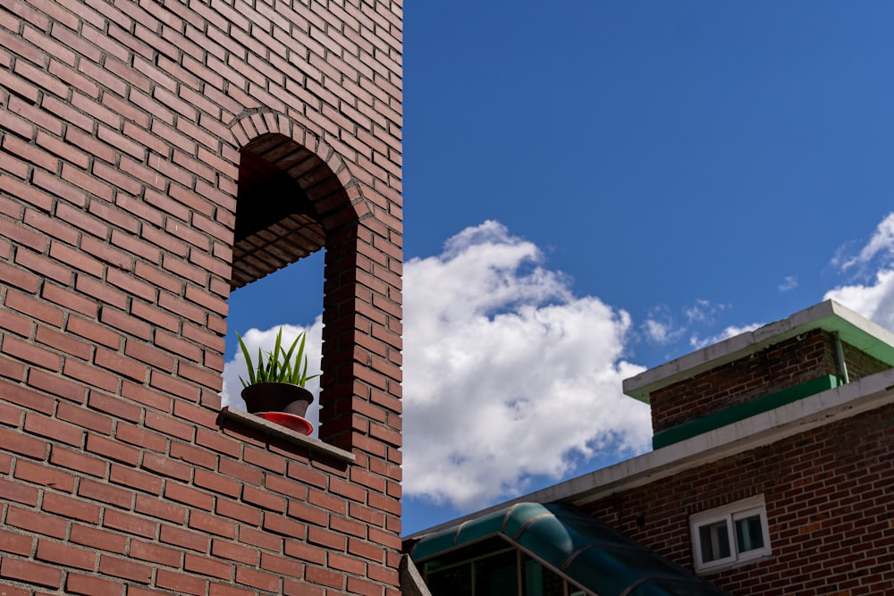 a large brick tower with a clock on the side of a building