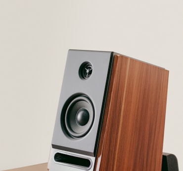 a speaker on a wooden table