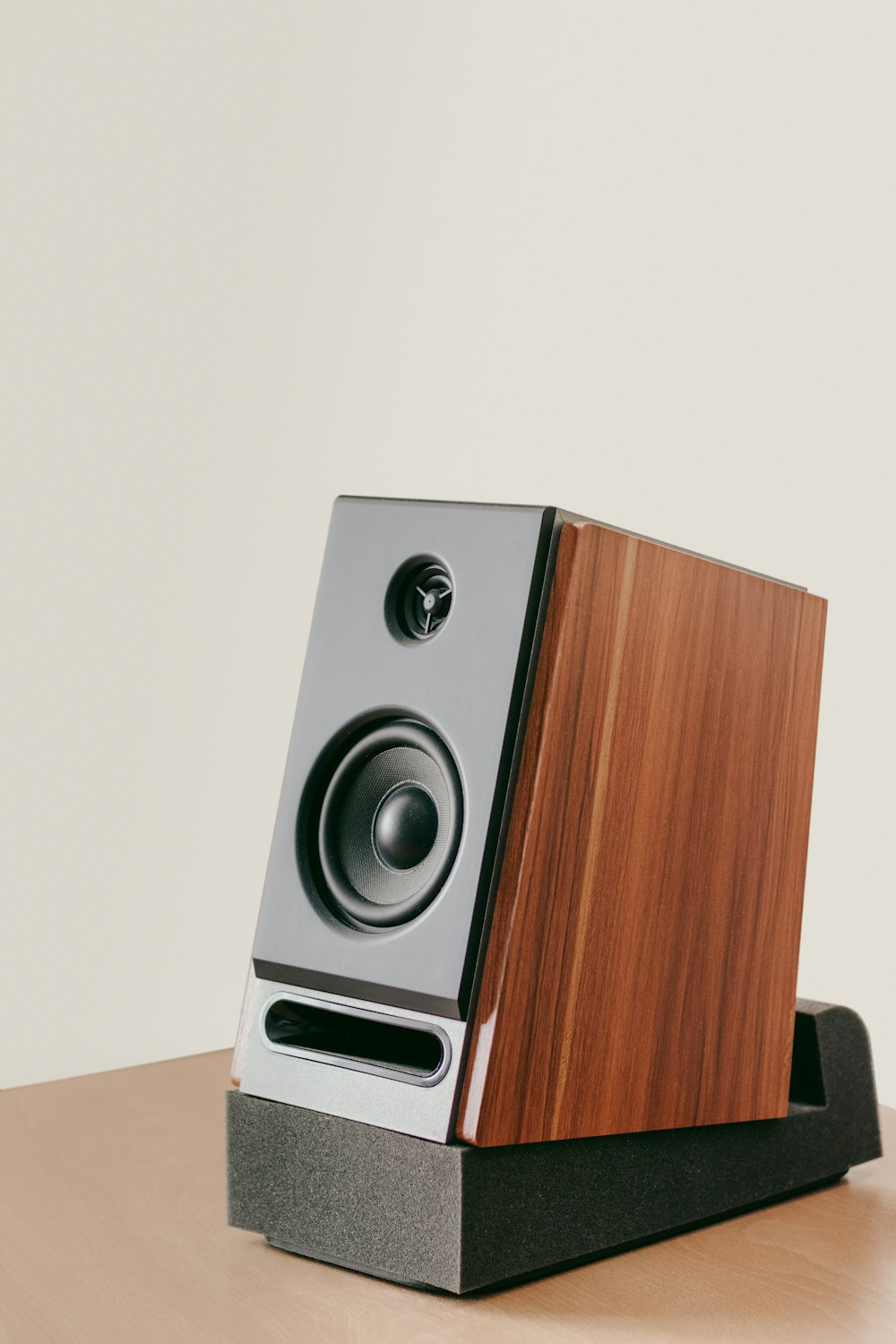 a speaker on a wooden table