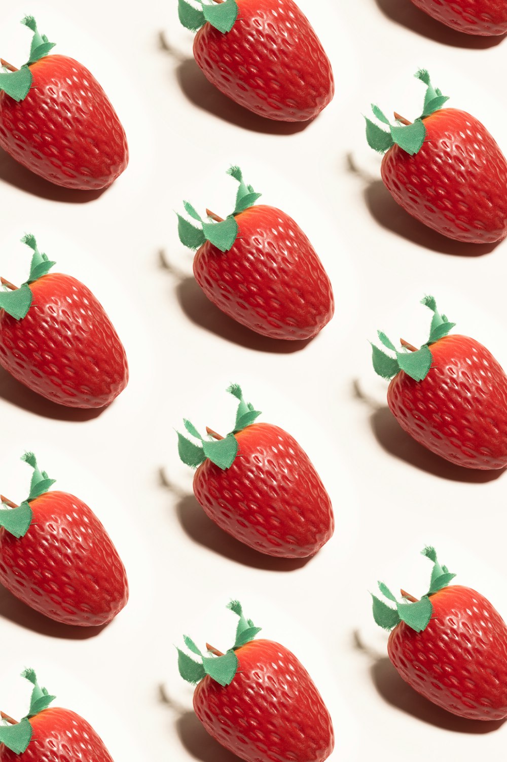 a close up of a cake with fruit on display