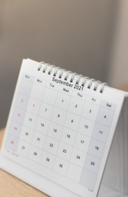 a calendar sitting on top of a wooden table