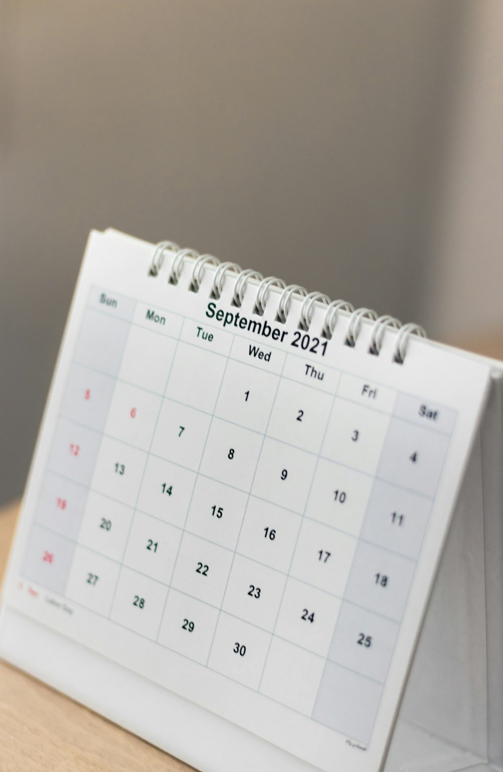 a calendar sitting on top of a wooden table