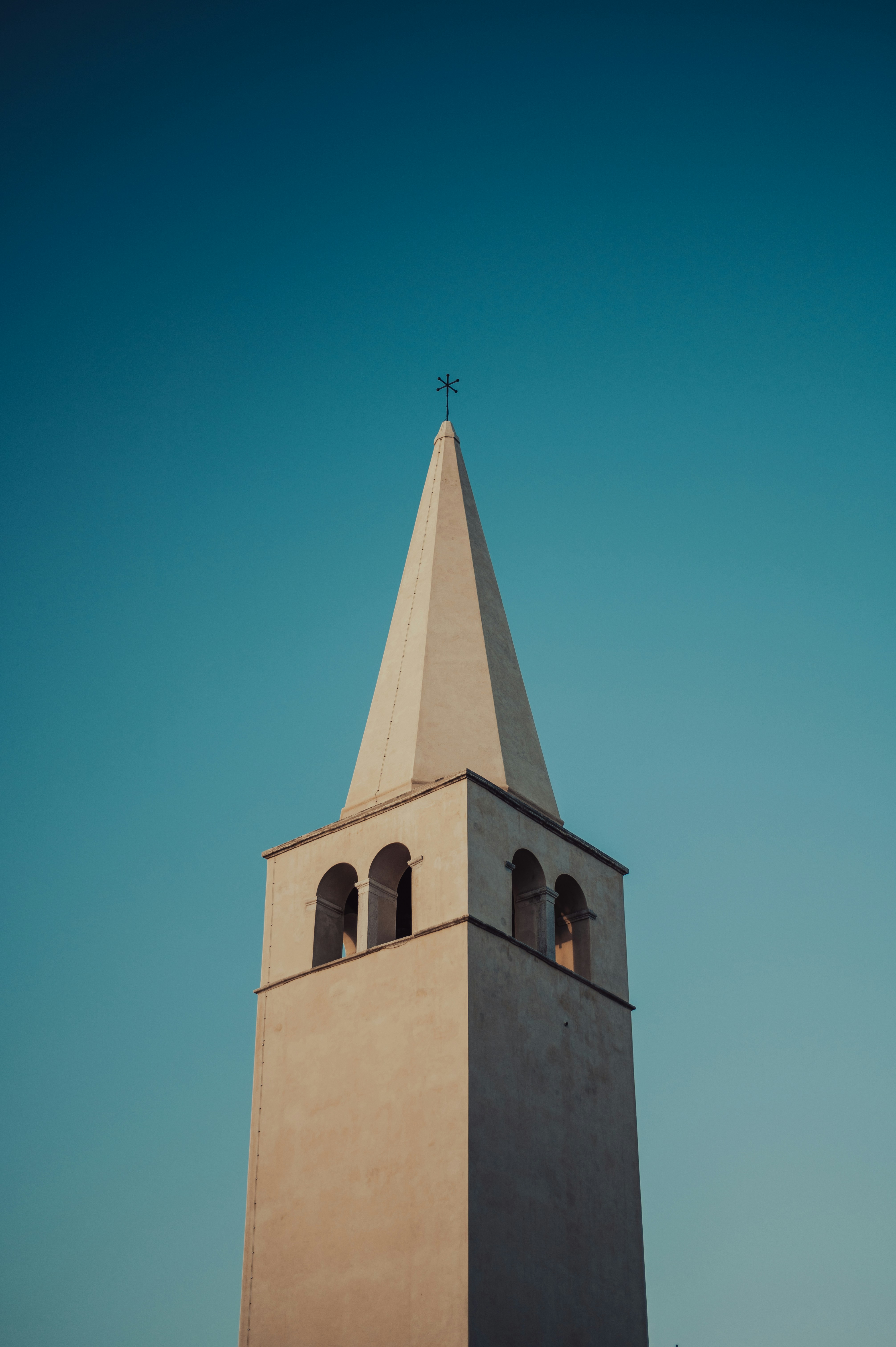 a large tall tower with a clock at the top of a building