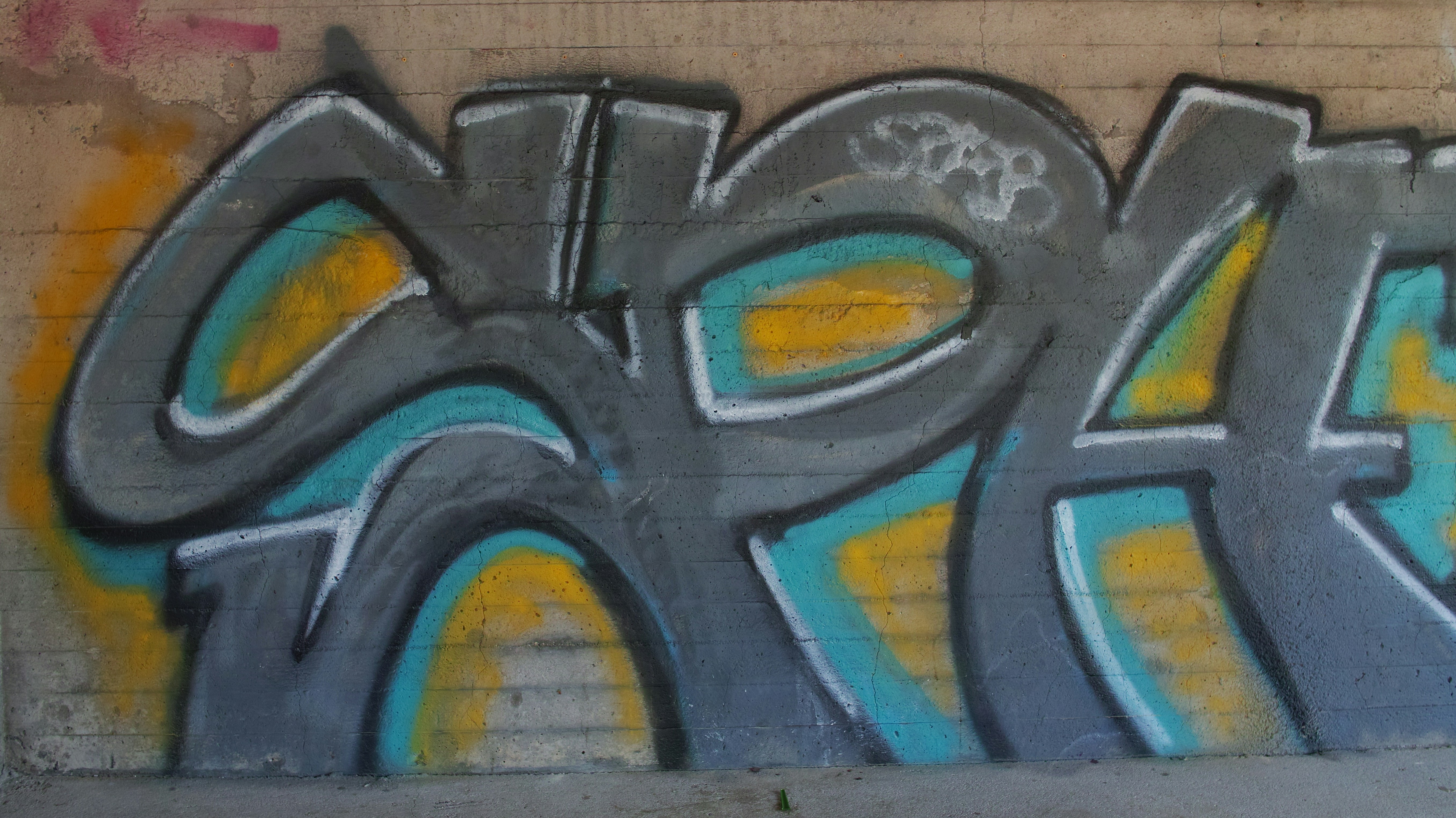 a wall with some graffiti on it