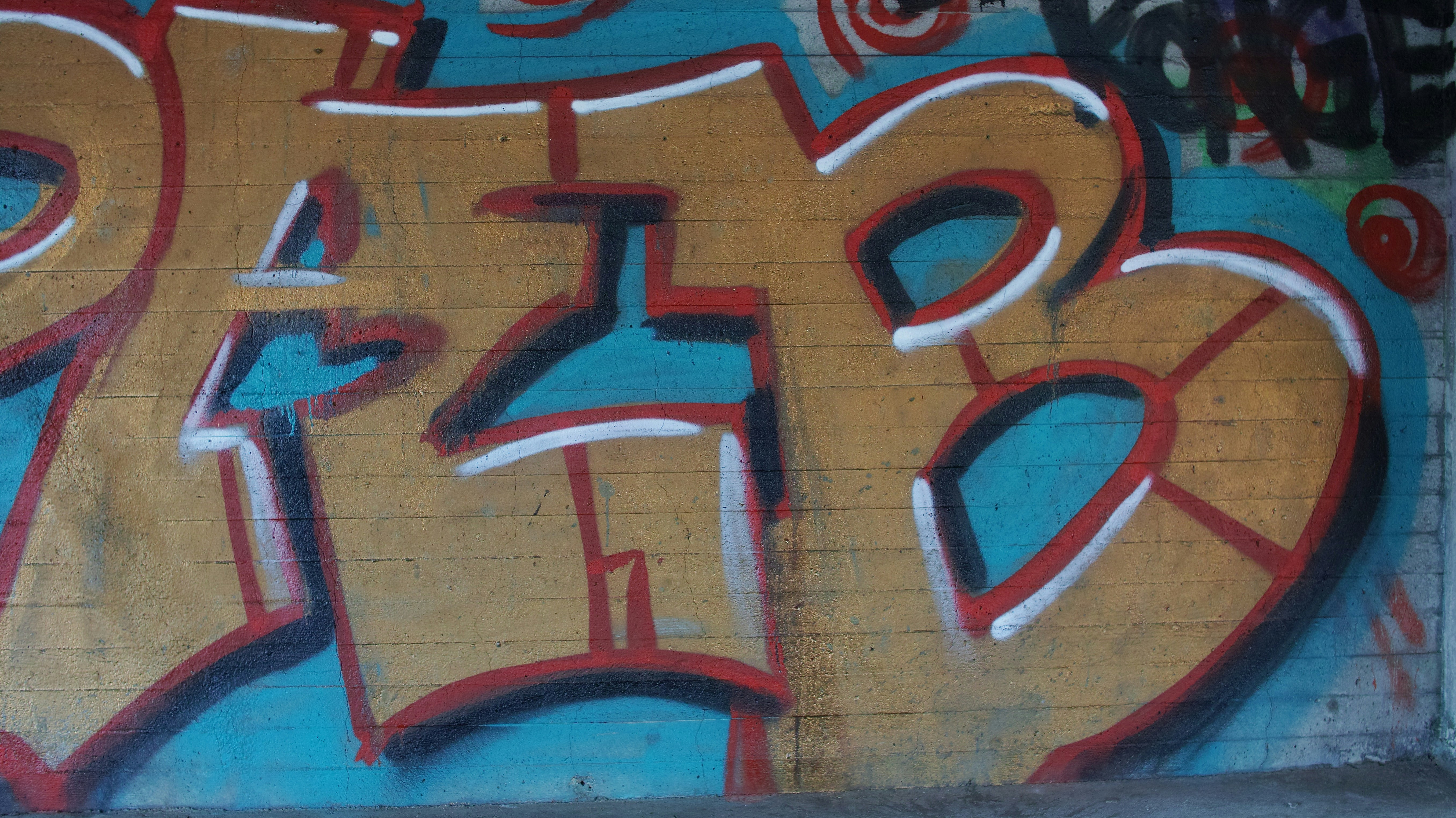 a wall with graffiti written on it