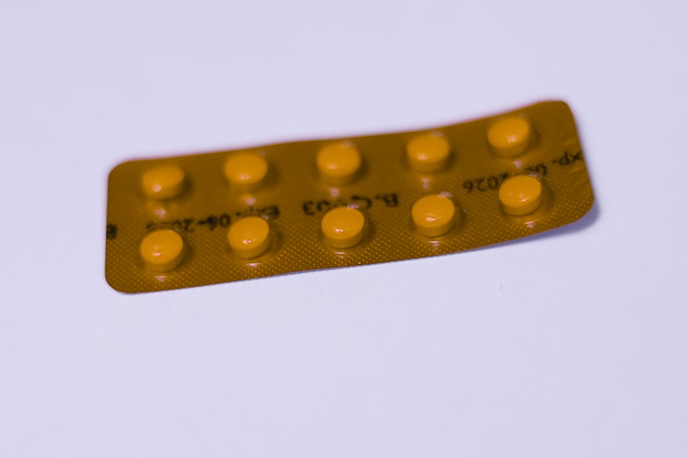 a yellow contraption sitting on top of a white table