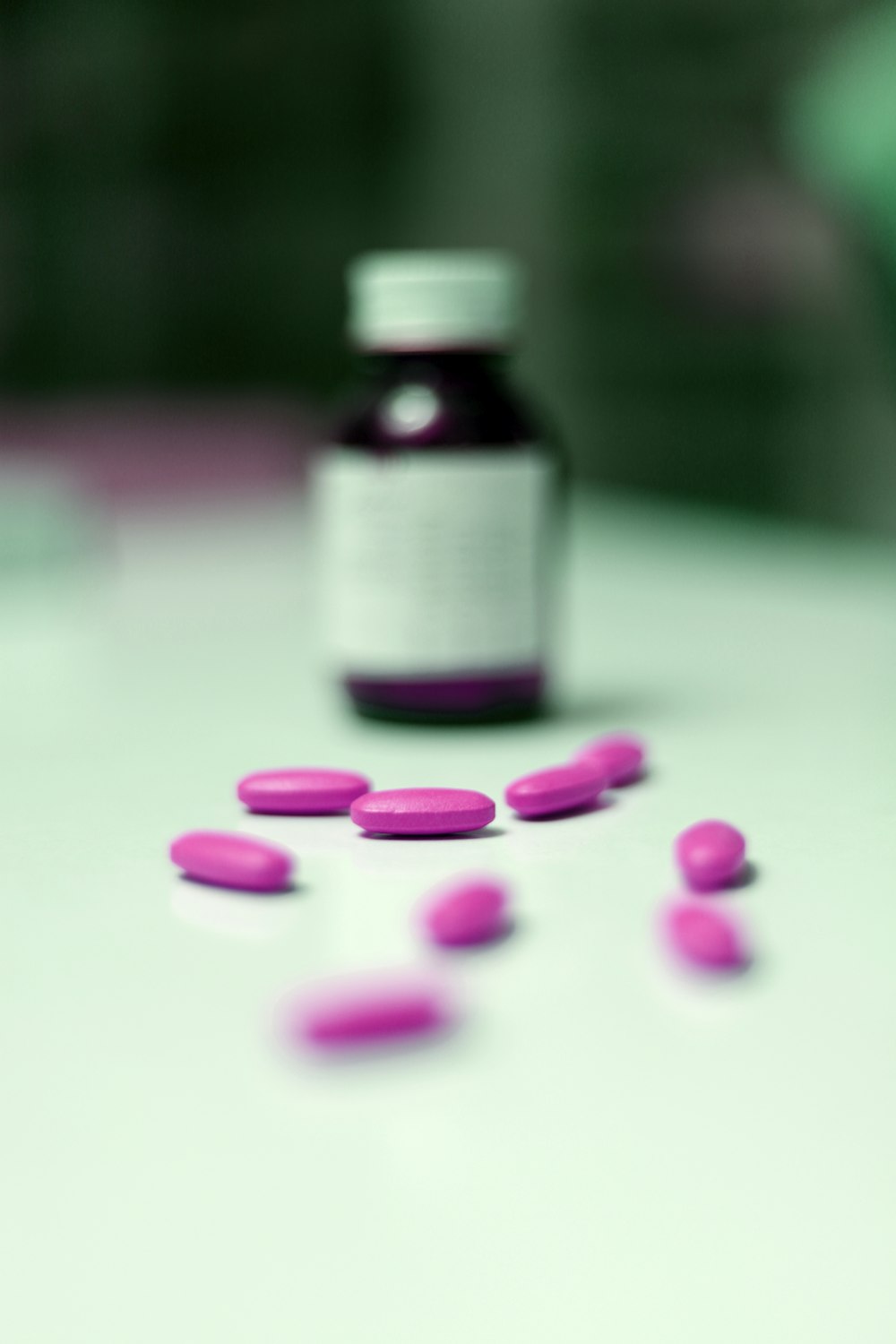 a bottle of pills sitting on top of a table