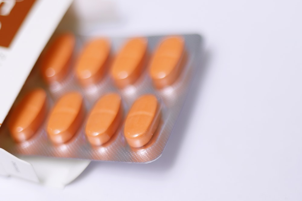 a pack of pills sitting on top of a white table