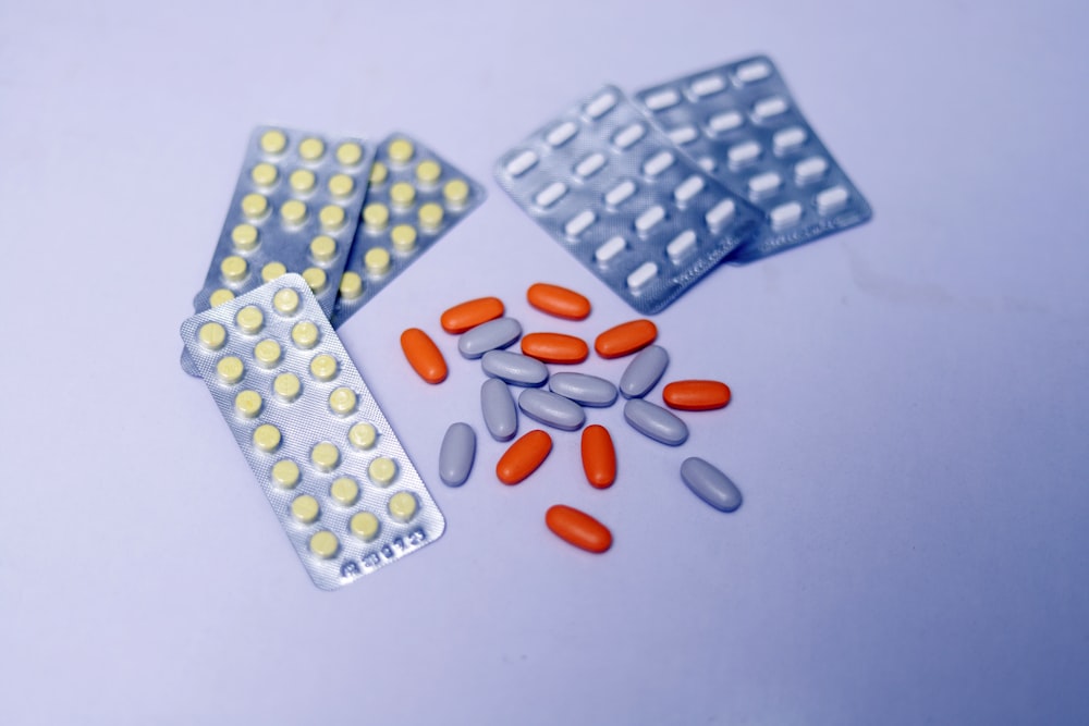 a close up of pills and tablets on a table