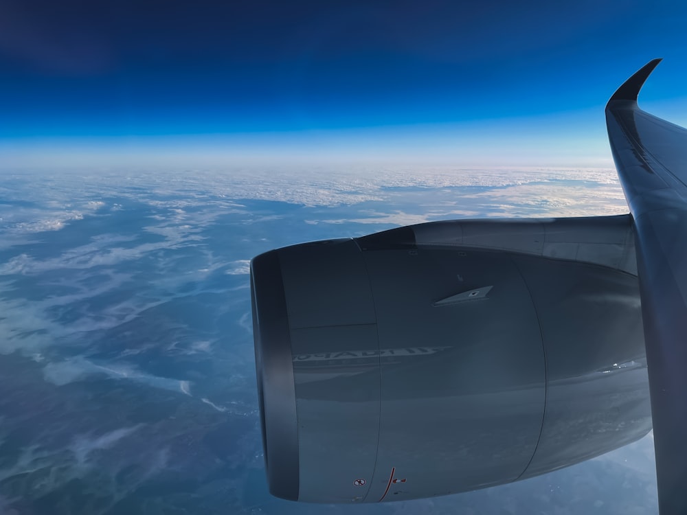 a view of the wing of an airplane in the sky