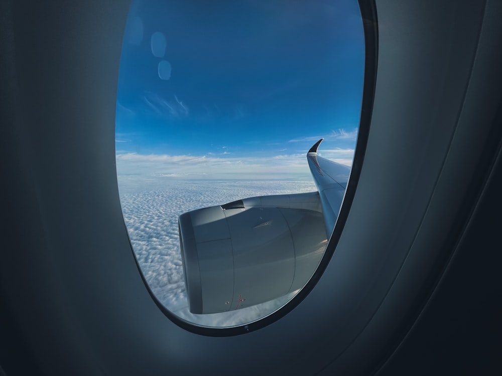 a view of the wing of an airplane through a window