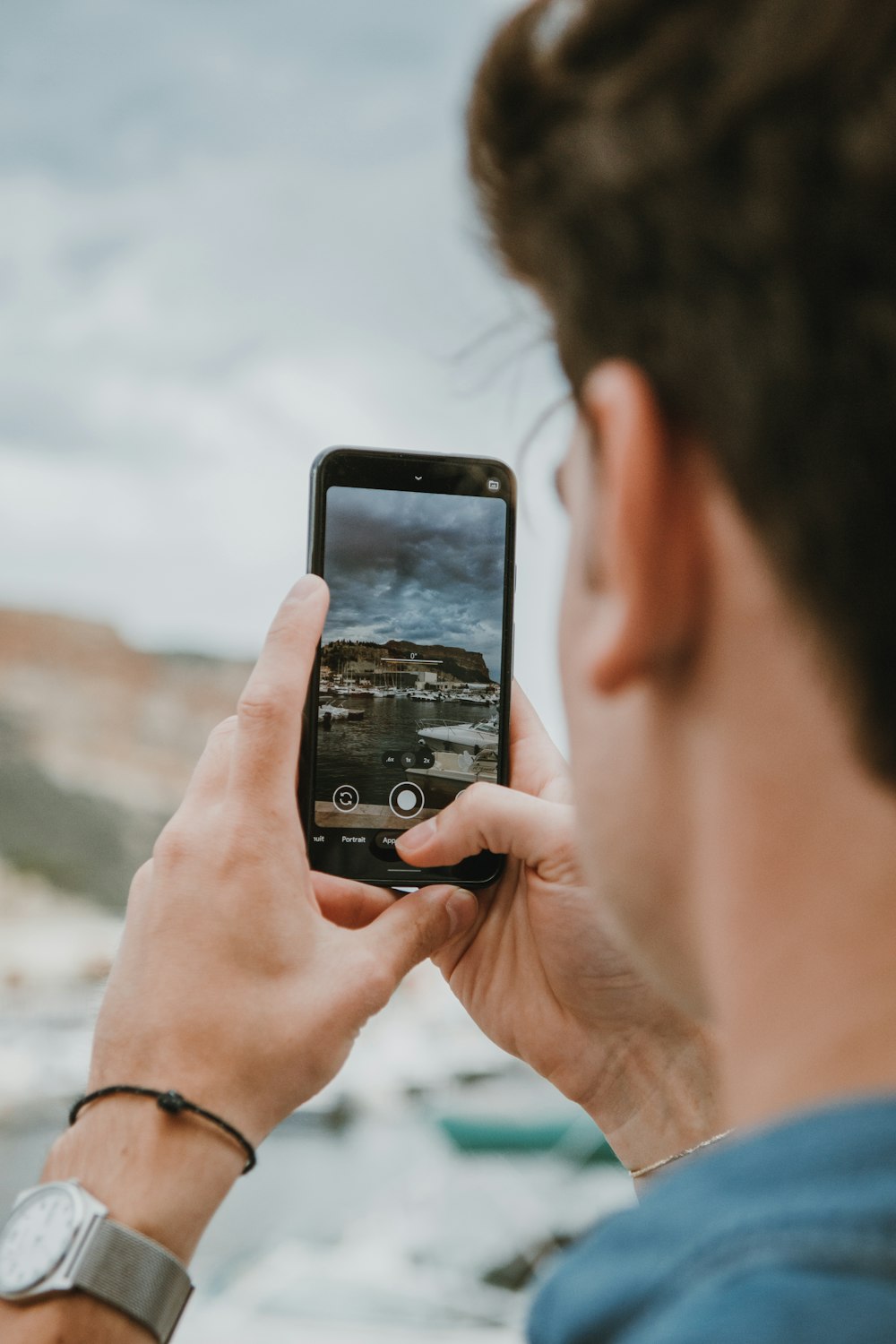 a man taking a picture with his cell phone