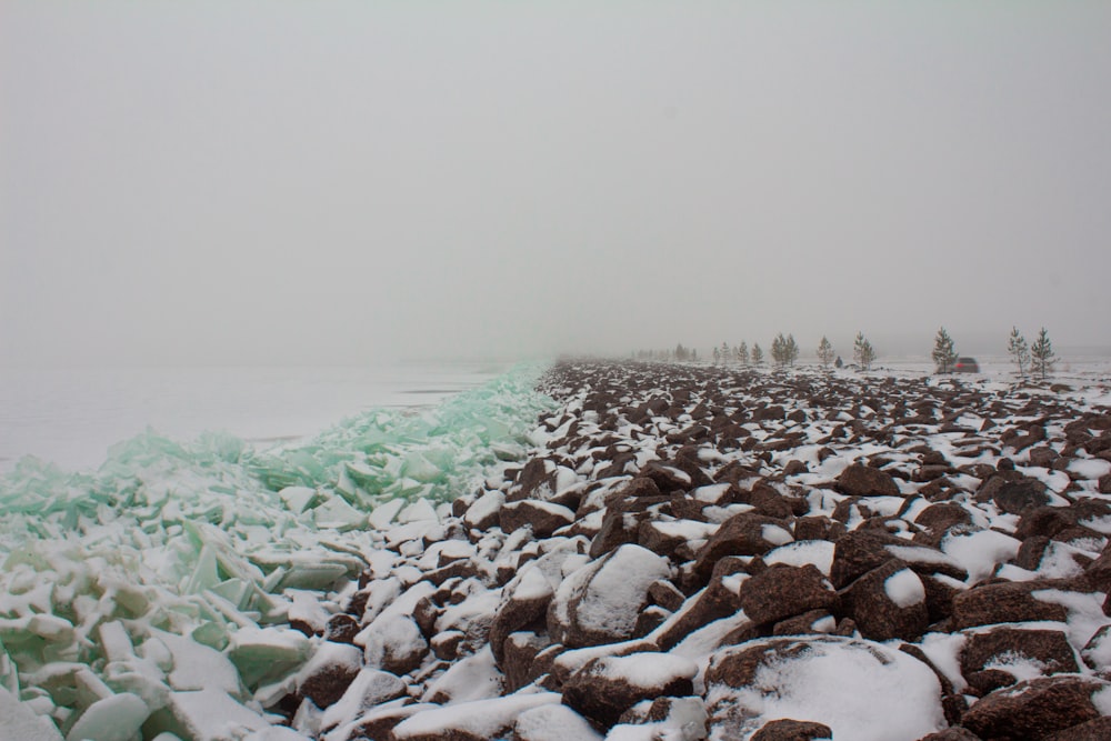 a beach covered in lots of ice and snow