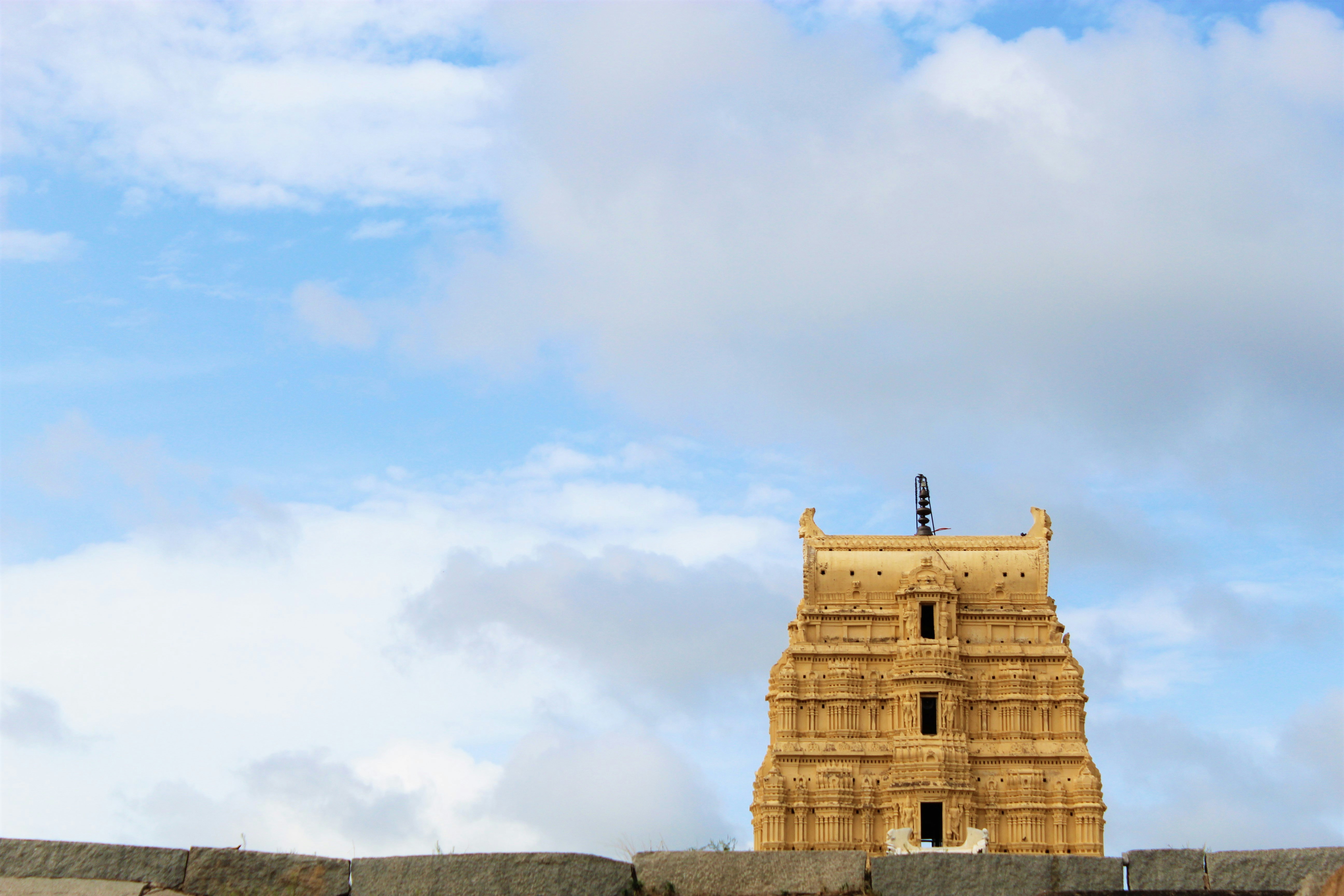 a tall tower with a clock on top of it, Sree Virupaksha Temple Hampi
