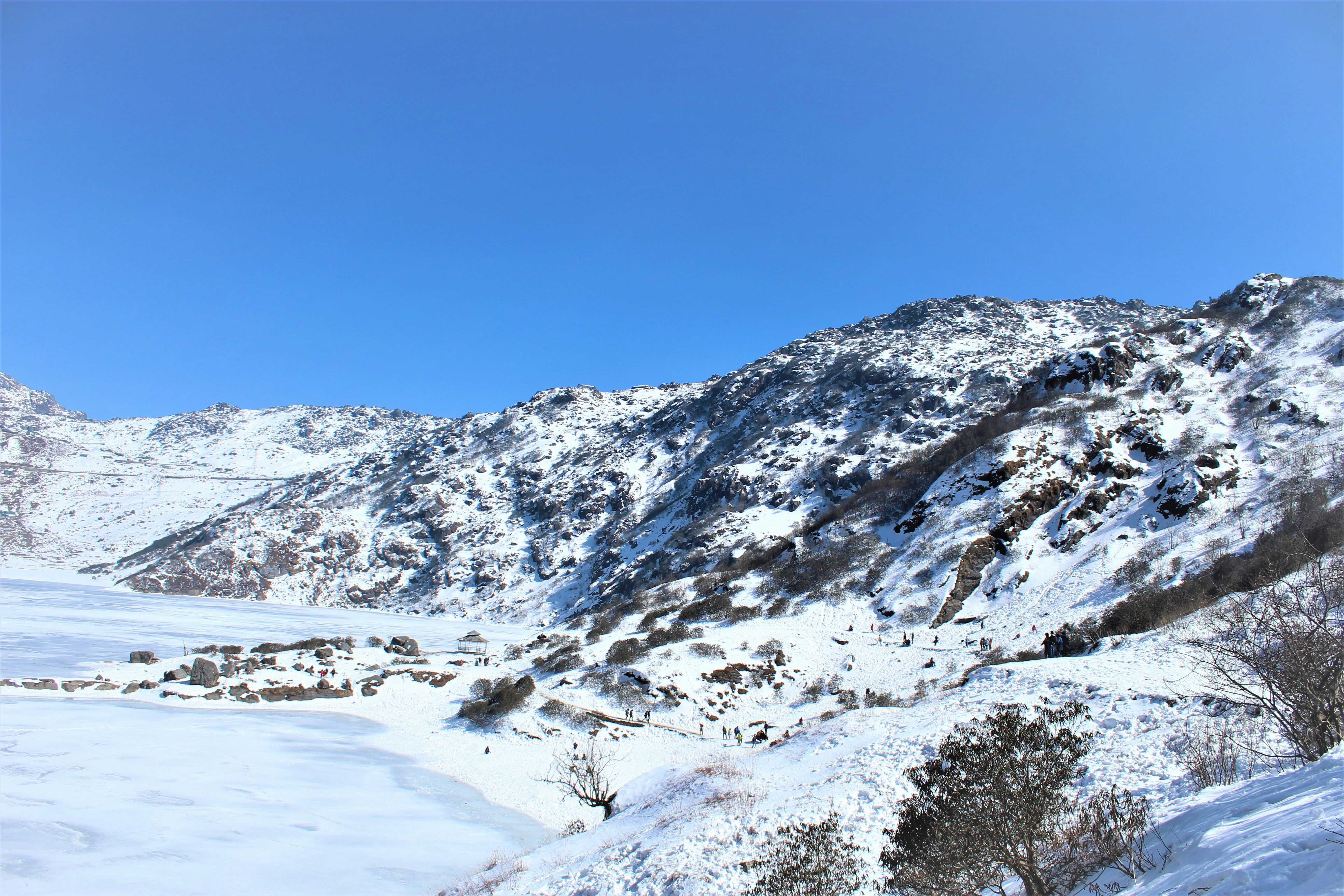 a snow covered mountain with a clear blue sky