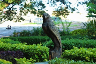 A vintage wooden garden ornament displayed outdoors.