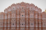 a very tall building with many windows and balconies