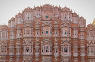 a very tall building with many windows and balconies