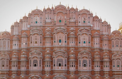 a very tall building with many windows and balconies
