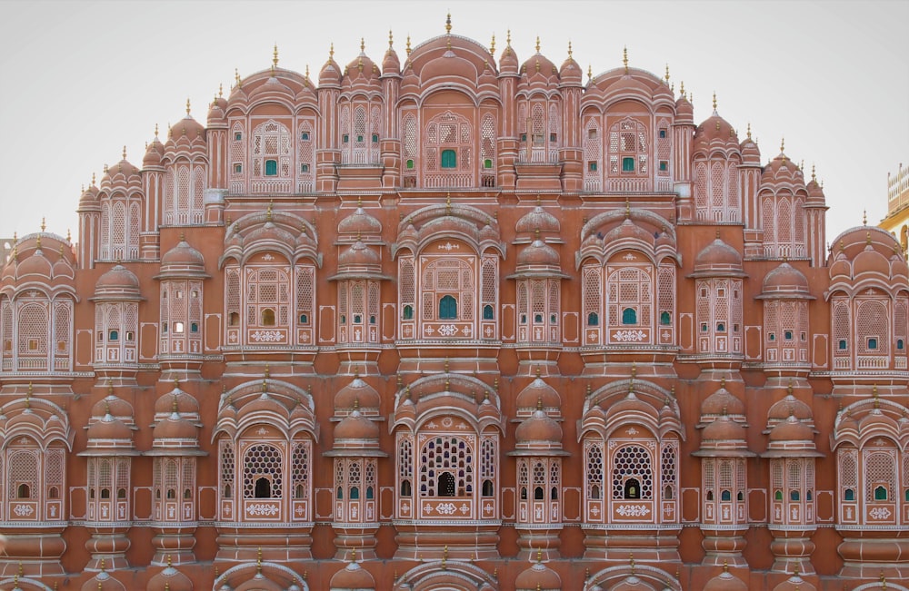 a very tall building with many windows and balconies