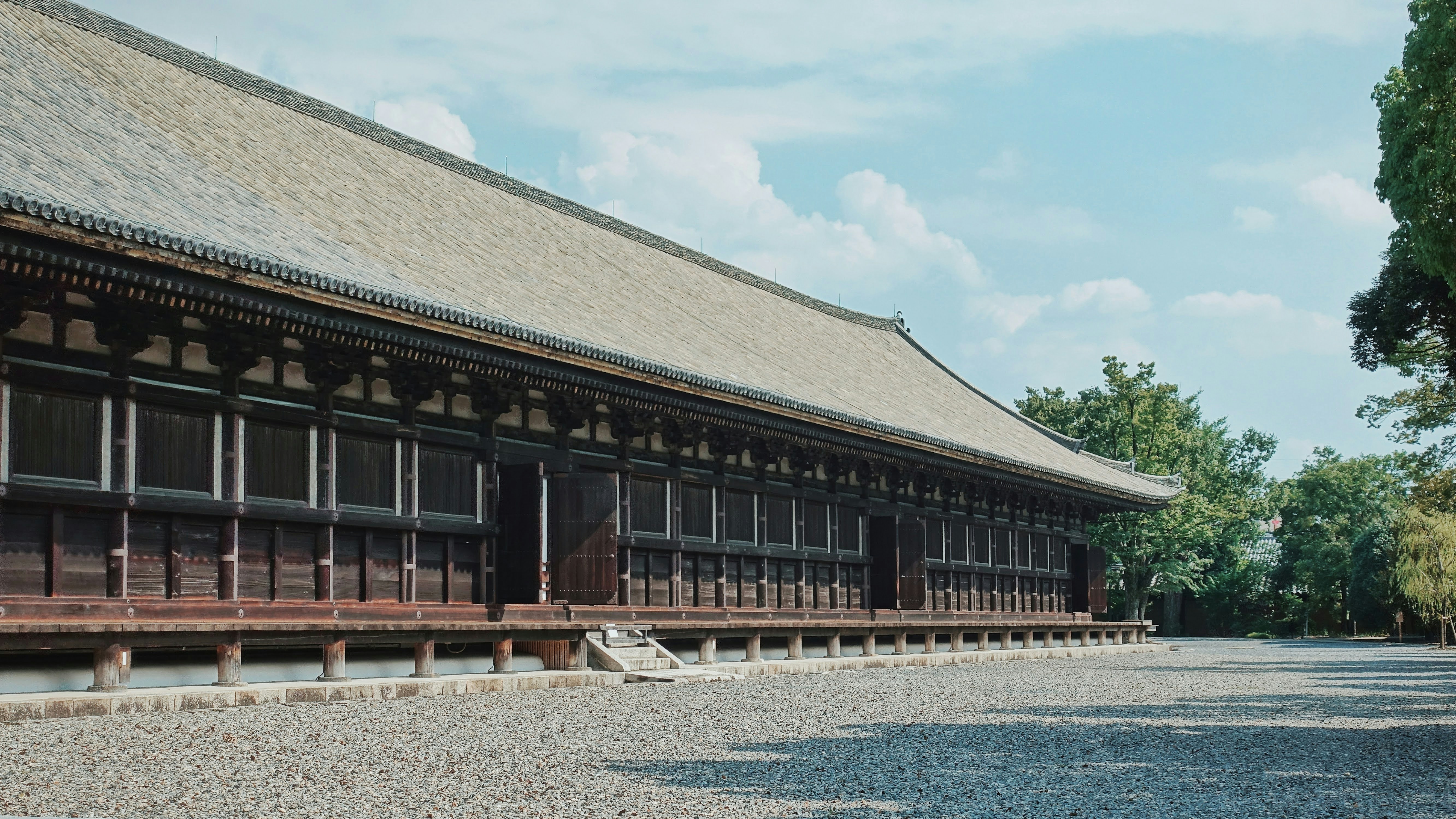 a large building with a tree in front of it