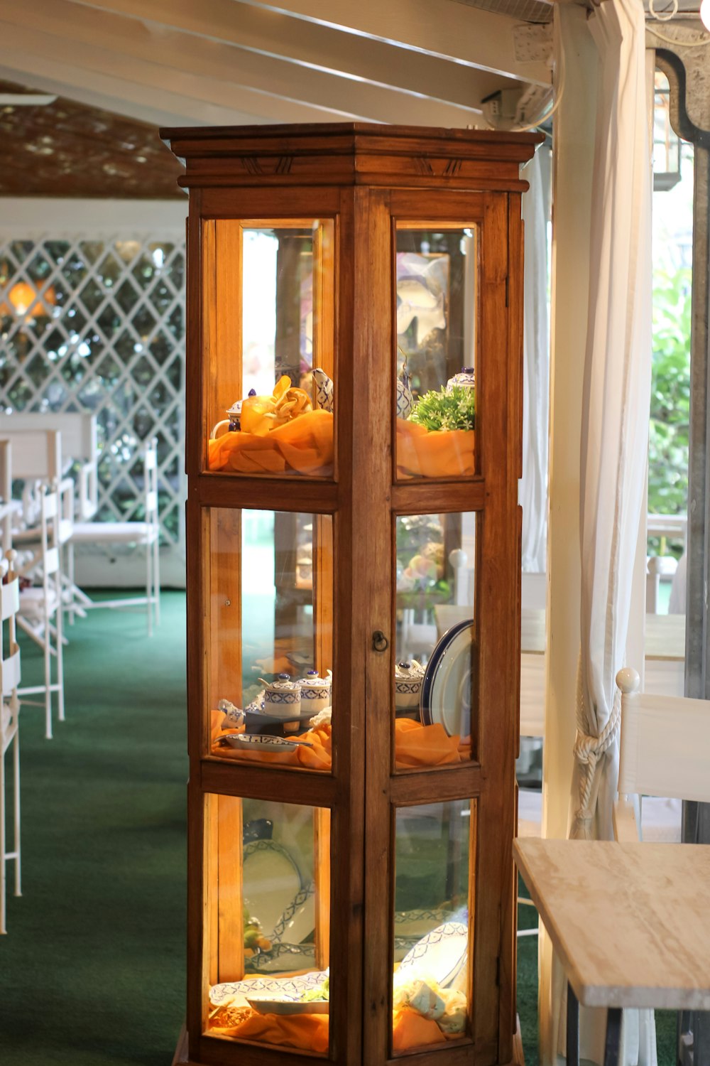 a tall wooden display case filled with lots of food