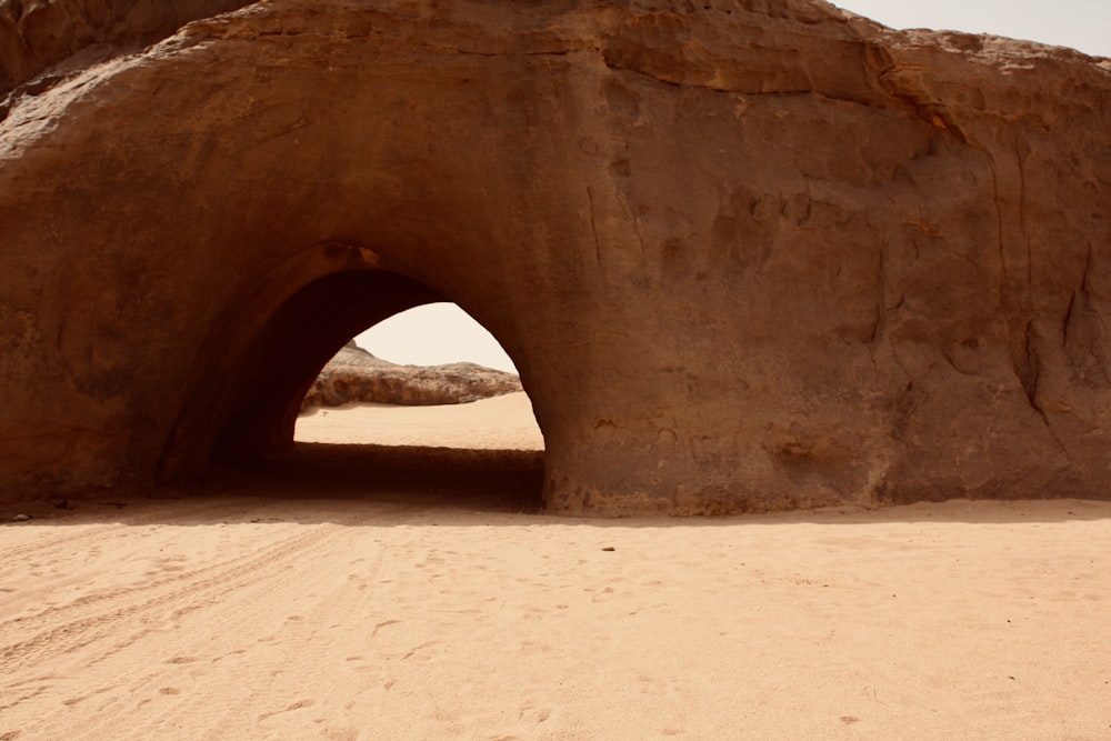 a large rock formation in the middle of a desert