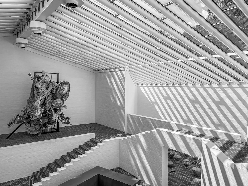 a black and white photo of a staircase in a building