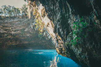 A serene underwater cave illuminated by natural light beams.