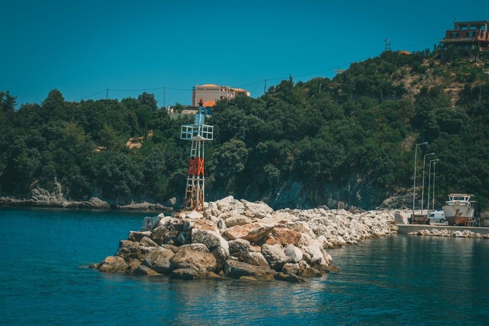 a large body of water next to a rocky shore