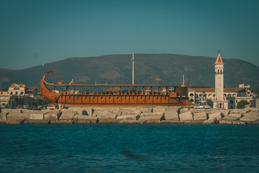 a large boat sitting on top of a body of water