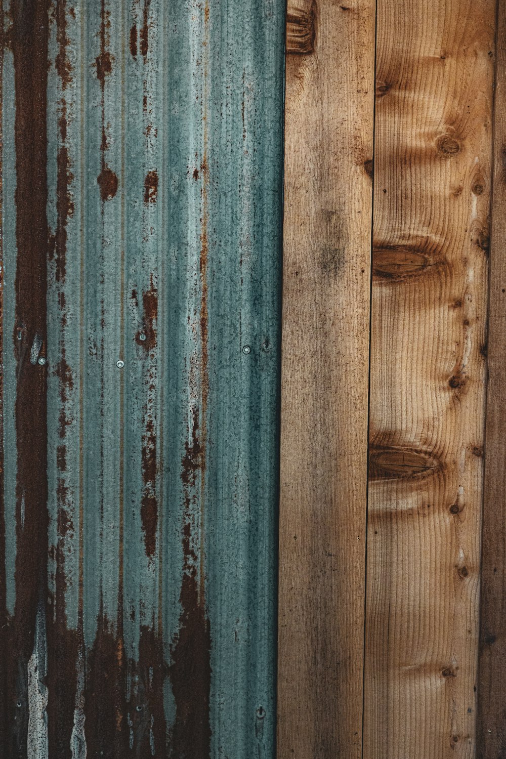 a close up of a wooden wall with peeling paint